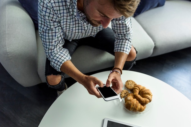 Young man working with smartphone