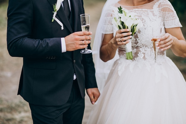 Young married couple drinking champaigne together