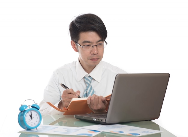 Young men working overtime in the office