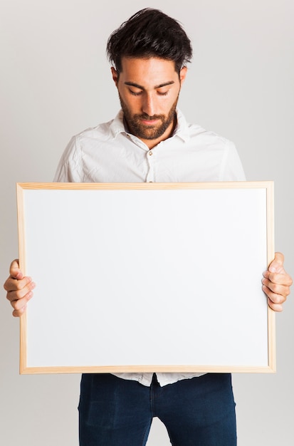 Free photo young model with whiteboard