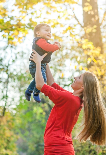 Young mother holding cute little boy