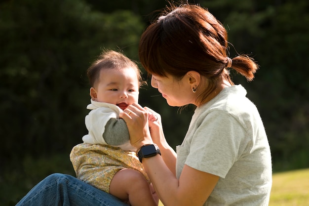 Free Photo young mother spending time with her baby