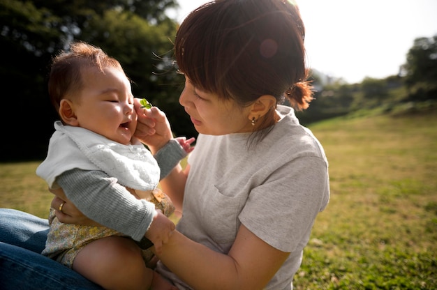 Free Photo young mother spending time with her baby