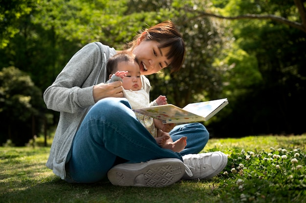 Free Photo young mother spending time with her baby