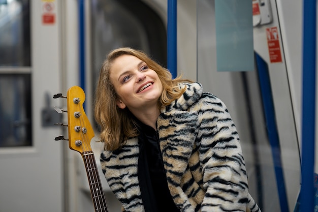 Free photo young musician singing around the city