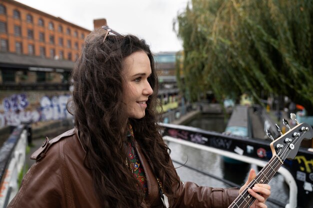 Young musician singing around the city