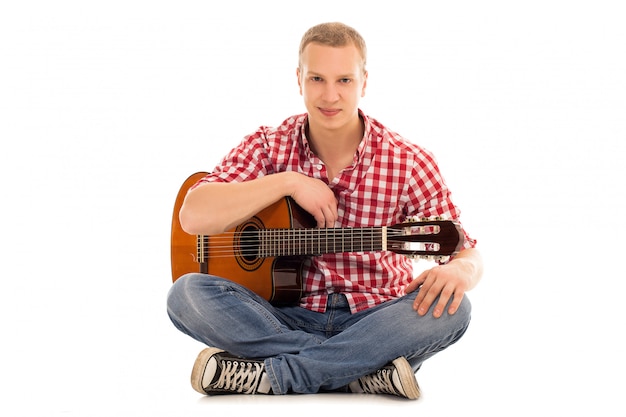 Free Photo young musician with a guitar