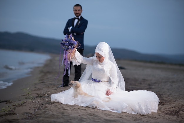 Free photo young muslim bride and groom wedding photos