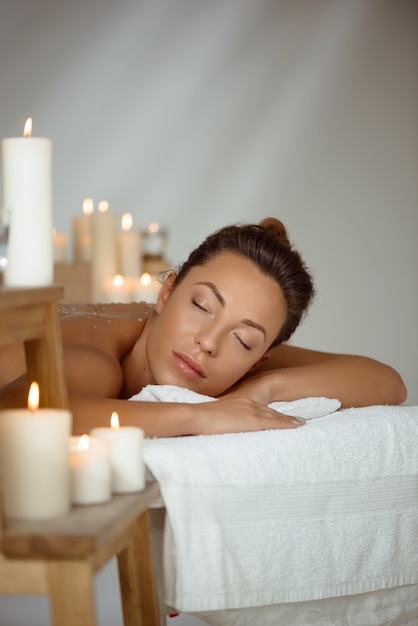 Free Photo young naked woman relaxing in spa salon.