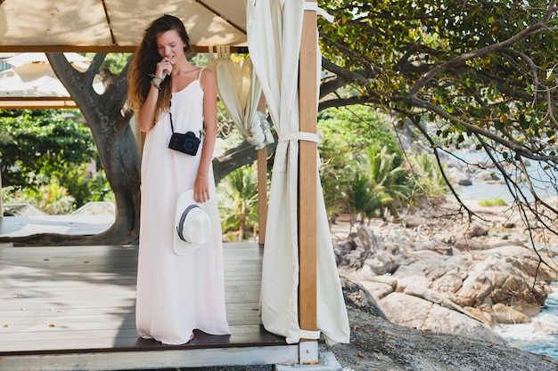 Free Photo young natural beautiful woman in pale gown posing in marquee, tropical vacation,