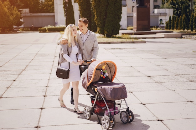 Young parents walking with their baby