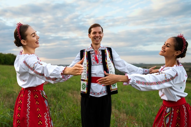 Free photo young people dancing folk medium shot