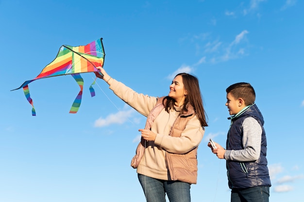 Free photo young people getting their kite up