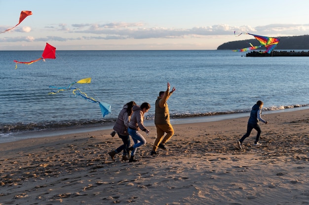 Young people getting their kite up