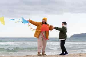 Free photo young people getting their kite up