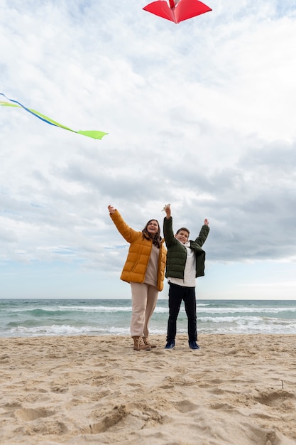 Young people getting their kite up