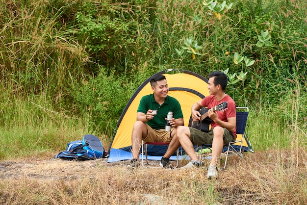 Young people resting on hill