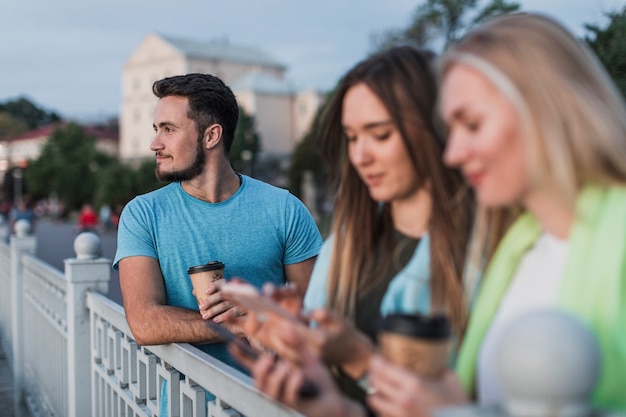 Young people resting on a railing