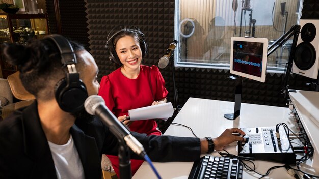 Young people working with professional radio equipment