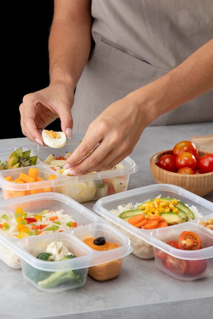 Free photo young person practicing batch cooking with healthy food