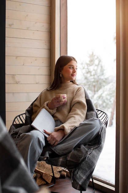 Young person relaxing with hot coffee