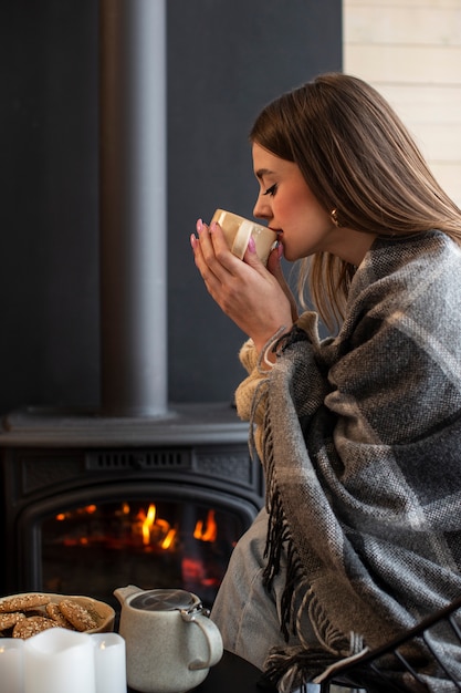 Free photo young person relaxing with hot coffee