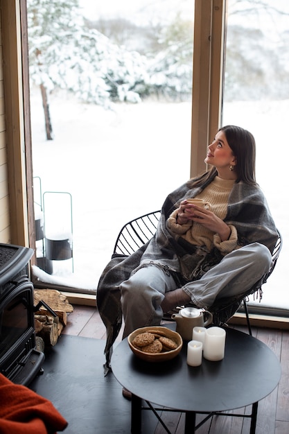 Free photo young person relaxing with hot coffee