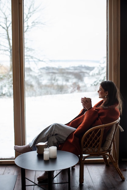 Free photo young person relaxing with hot coffee