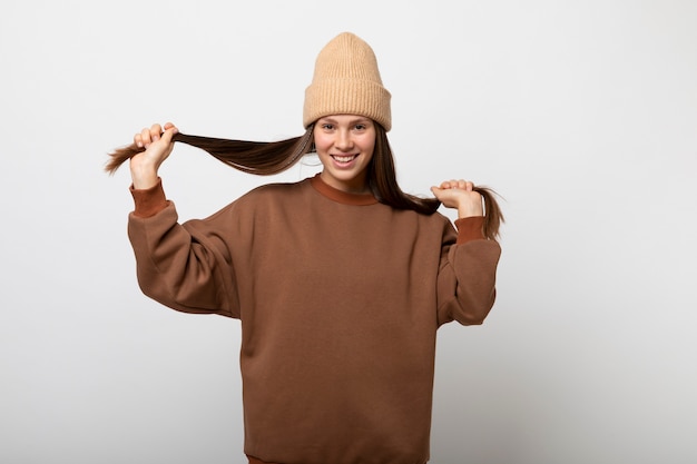 Free Photo young person wearing hoodie mockup