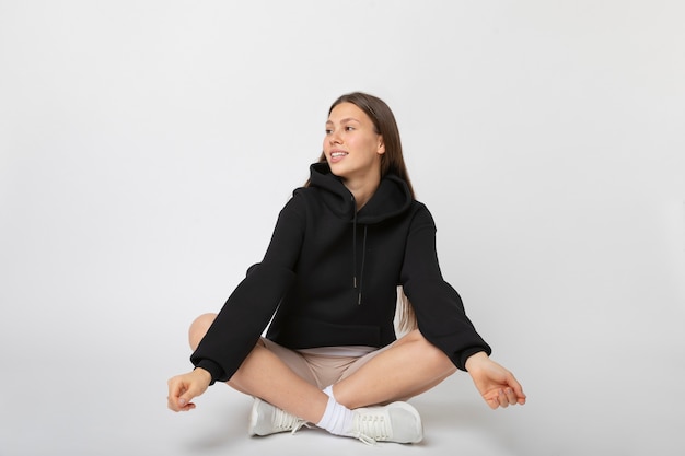 Free photo young person wearing hoodie mockup