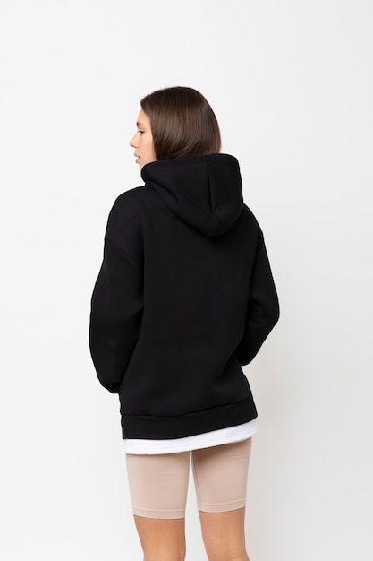 Free Photo young person wearing hoodie mockup