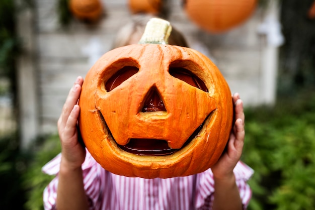 Young playful girl enjoying Halloween