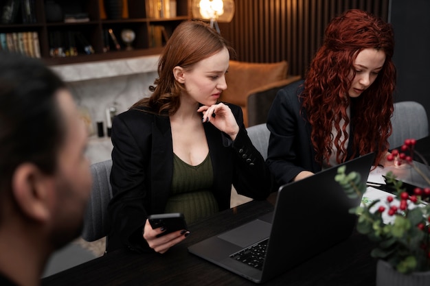 Free photo young pregnant woman at work