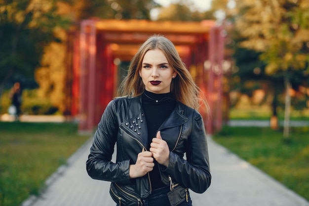 young and pretty girl walking in a summer city