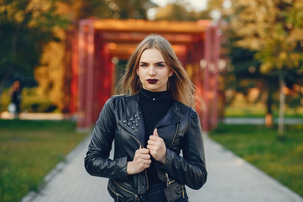 young and pretty girl walking in a summer city