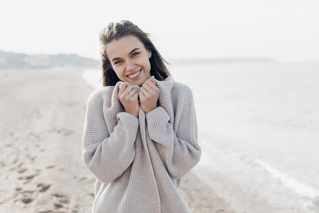 young pretty woman cozy portrait outdoors