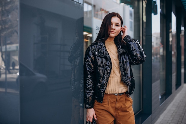 Young pretty woman in warm jacket outdoors