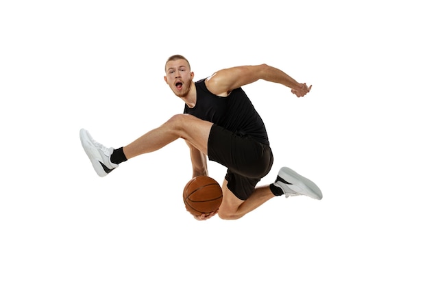 Free photo young professional basketball player in motion training playing isolated over white studio background