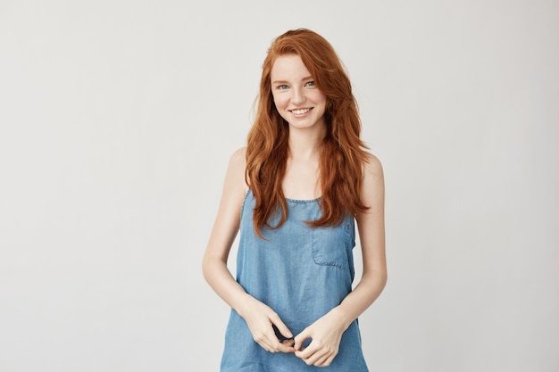 Free photo young redhead woman smiling.