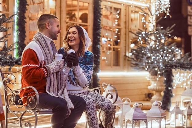 Young romantic couple at Christmas time, enjoying spending time together