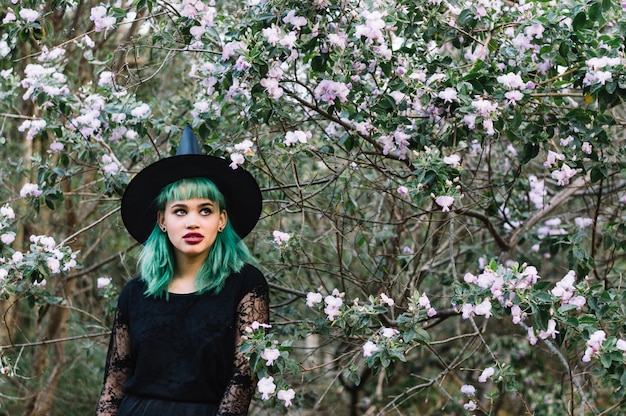 Free Photo young sensual woman witch in woods