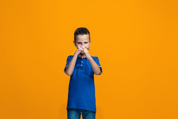 Young serious thoughtful teen boy. Doubt concept.