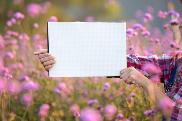 Free photo the young smiling farmer stood empty white paper.