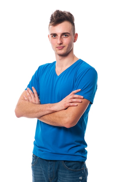 Young smiling man with arms crossed