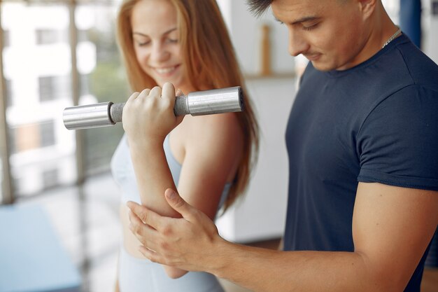 Young sports people training in a morning gym