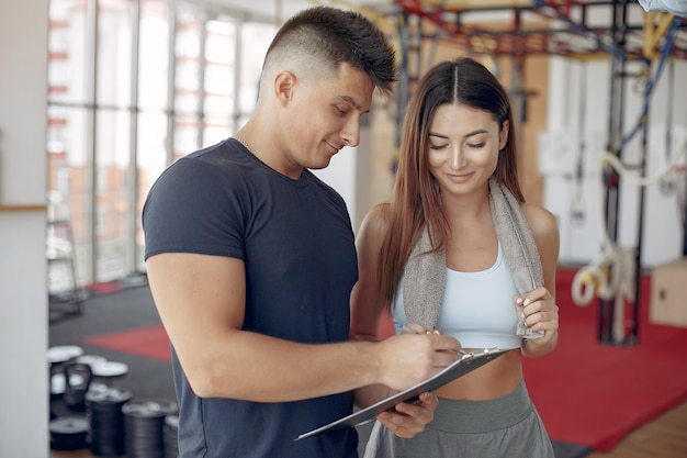 Young sports people training in a morning gym