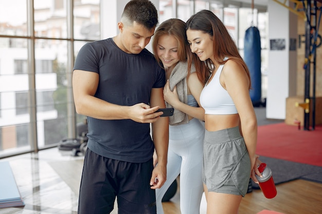 Free Photo young sports people training in a morning gym