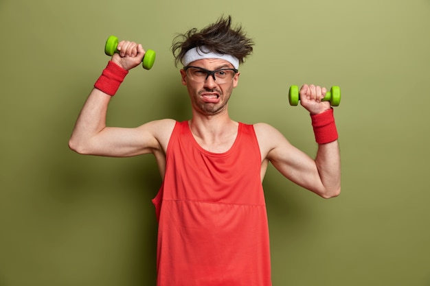 Young sportsman getting ready for his training isolated