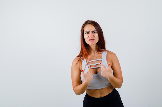 Free photo young sporty woman with long hair being angry