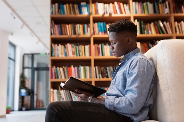 Young student learning in the library